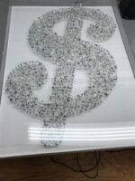 This art piece is made from tiny cut up pieces oif hundred dollar bills.  The linen backing was water stained, which we were able to remove